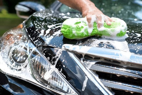 A person cleaning car bonnet with carcarez Professional Microfiber Applicator Pad 
