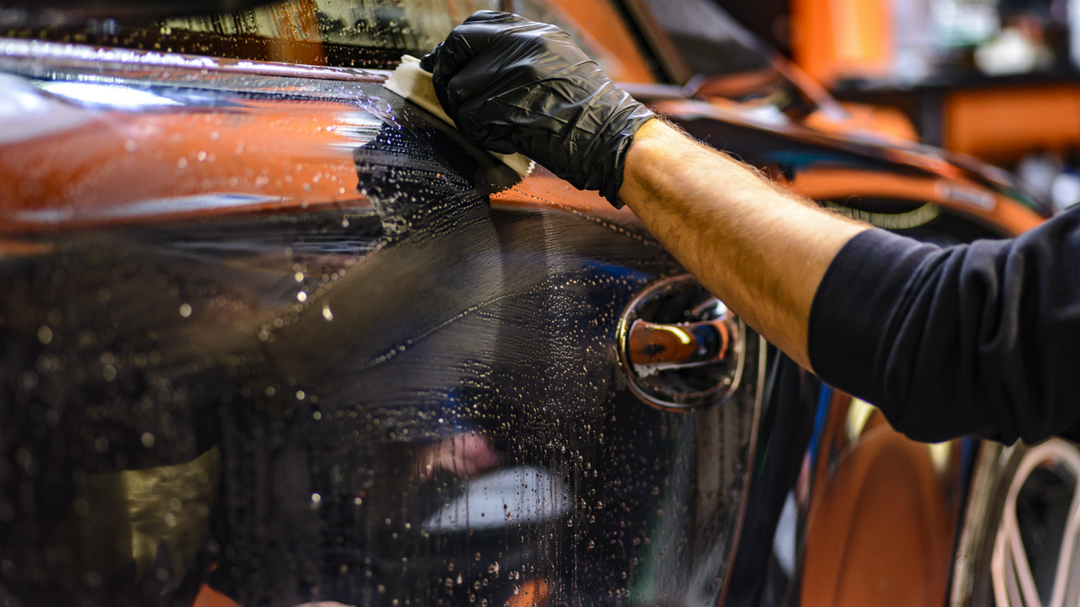 A person cleaning his car with Auto Detailing Magic Clay Bar carcarez product
