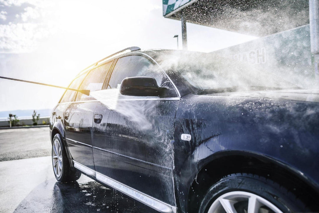 High-pressure washing car outdoors. Car washing under the open sky