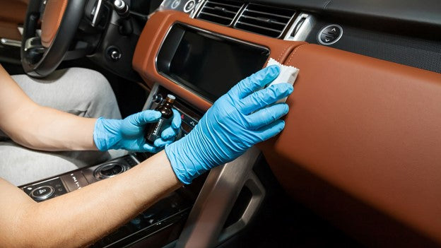 Man Cleaning car with CarCarez clay bar