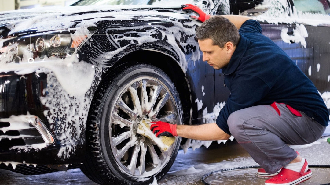 Person cleaning car tires with carcarez brush