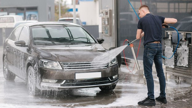 Person cleaning car with CarCarez Pressure Washer pump