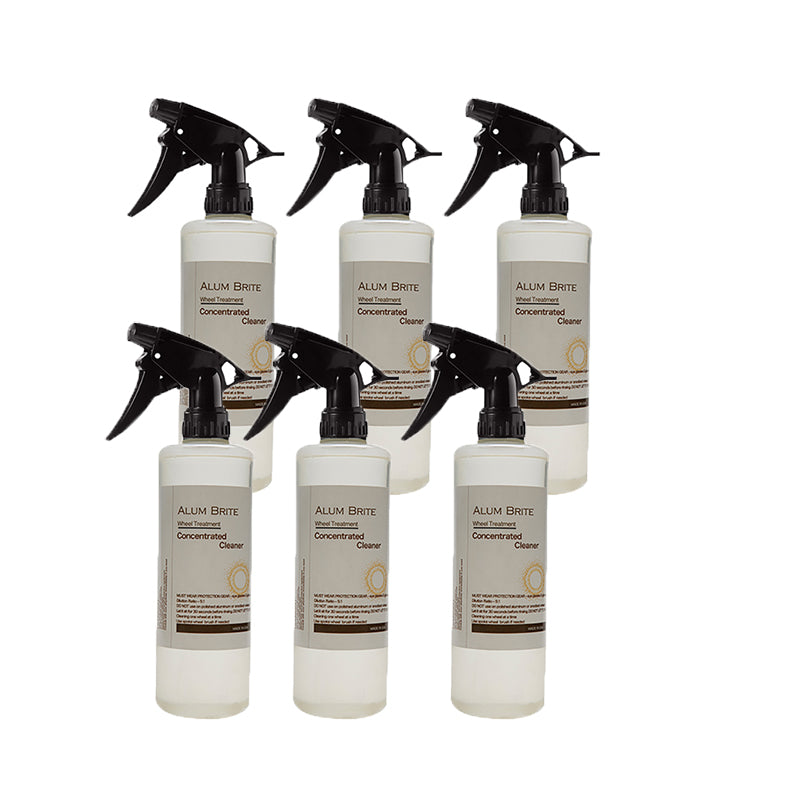 Set of six Alum Brite concentrated cleaner bottles with black sprayers on a white background