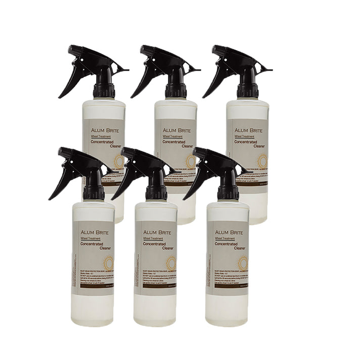 Set of six Alum Brite concentrated cleaner bottles with black sprayers on a white background