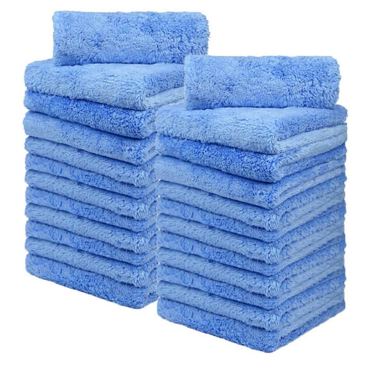 Stack_of_blue_towels_on_a_white_background